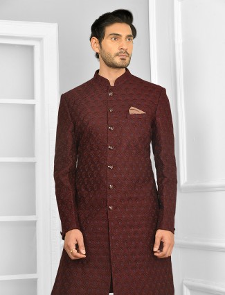 An alluring wedding wear maroon indowestern suit