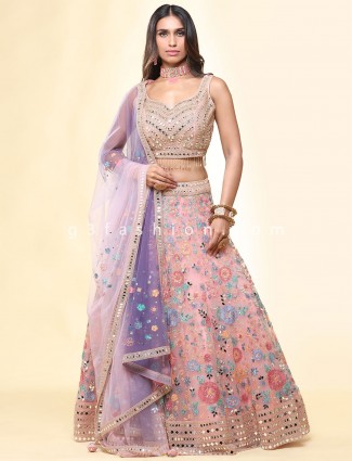 Pink net wedding wear lehenga choli with mirror details