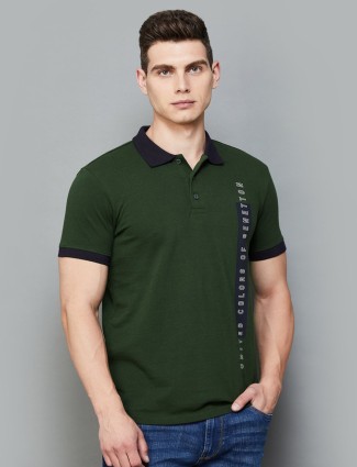 UCB dark green polo t-shirt